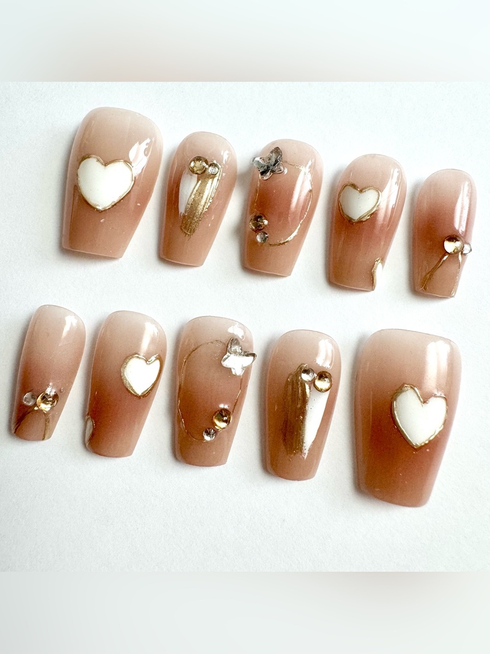 Nude Blush Press-On Nails with Gold Accents and White Hearts